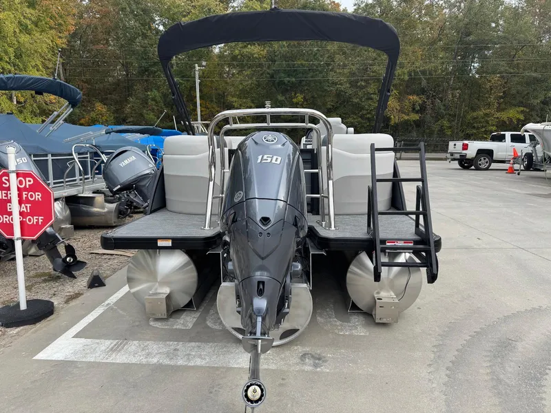 Slide: The Image of 2025 Godfrey Sweetwater 2086 SB pontoon boat with 150 HP engine, parked outdoors. - 3