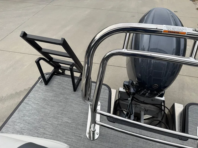 Slide: The Image of 2025 Godfrey Sweetwater 2086 SB boat with motor and ladder on deck. - 31