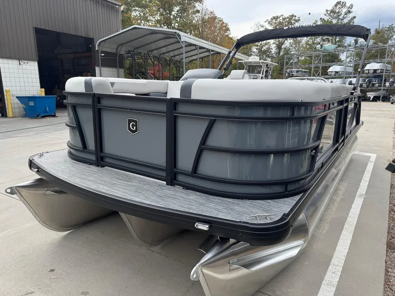Slide: The Image of 2025 Godfrey Sweetwater 2086 SB pontoon boat in a marina setting. - 7