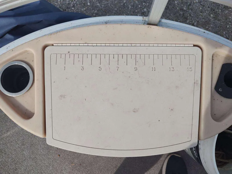 Slide: The Image of Measuring board on 2016 Sun Tracker Fishin' Barge 22 DLX with cup holders. - 15