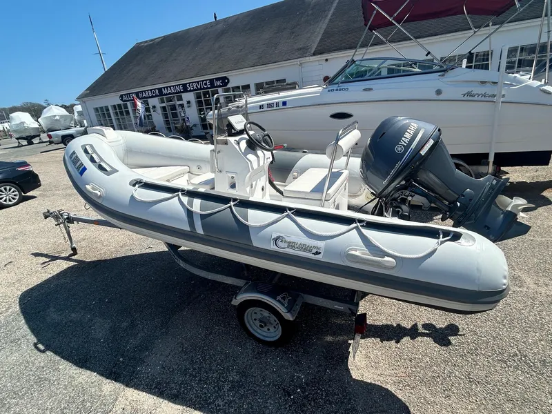 Slide: The Image of 2021 North Atlantic Inflatables RIB420 boat with Yamaha engine on trailer. - 3