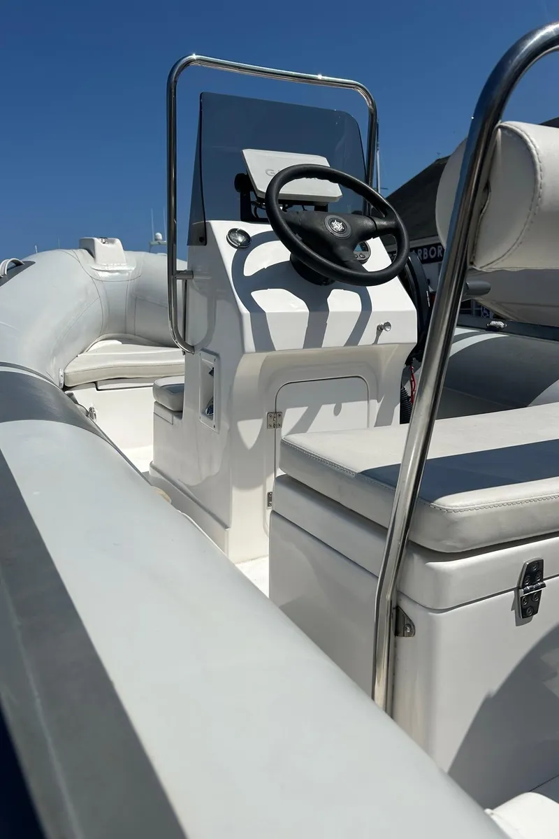 Slide: The Image of 2021 North Atlantic Inflatables RIB420 boat interior with steering console and seating. - 8