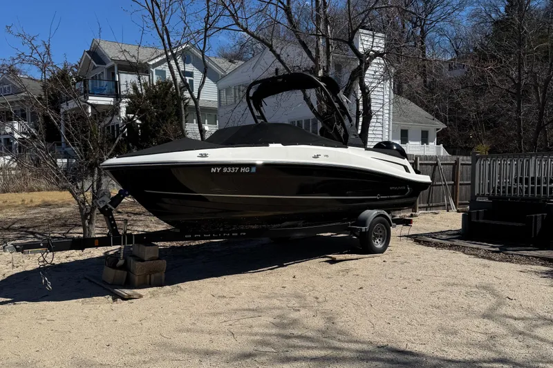 Slide: The Image of 2022 Bayliner VR5 Bowrider OB on trailer, parked in residential area. - 22