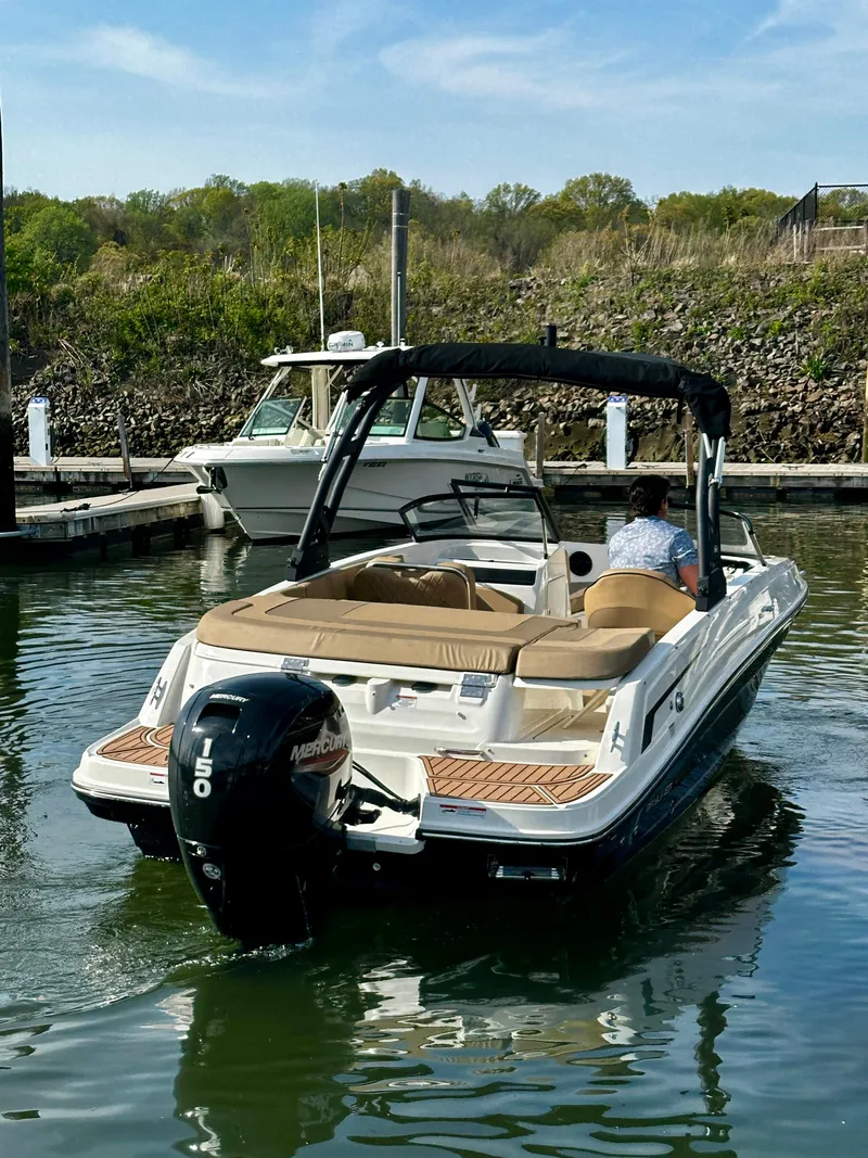 Slide: The Image of 2022 Bayliner VR5 Bowrider OB in marina, featuring a 150 horsepower outboard engine. - 6