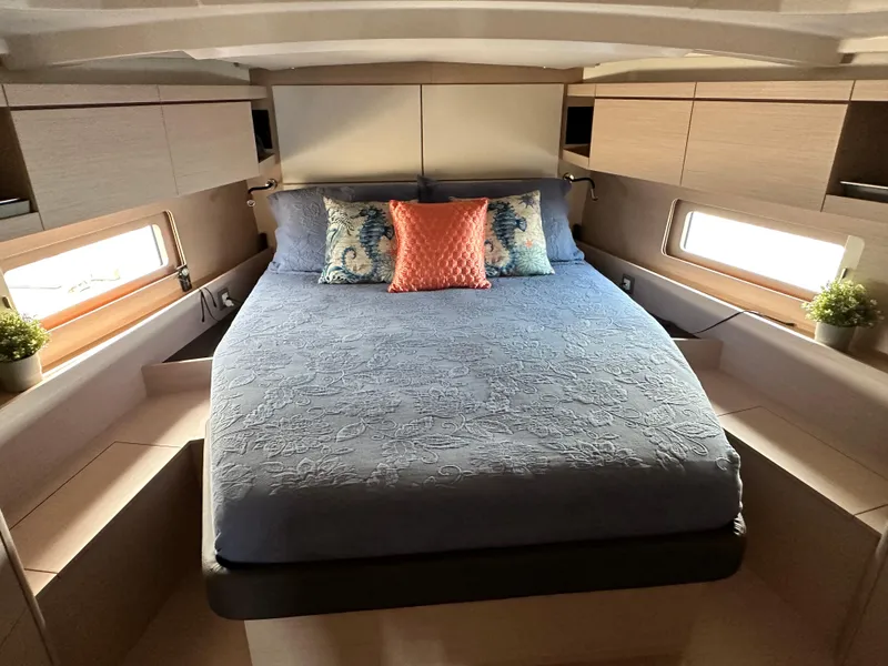 Slide: The Image of Luxurious cabin interior of 2022 Beneteau Oceanis 46.1 yacht with elegant bedding and decor. - 44