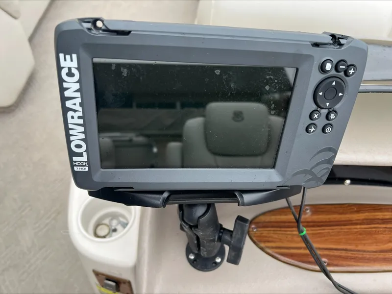 Slide: The Image of Lowrance fish finder on 2003 Premier 250 Escapade boat dashboard. - 10