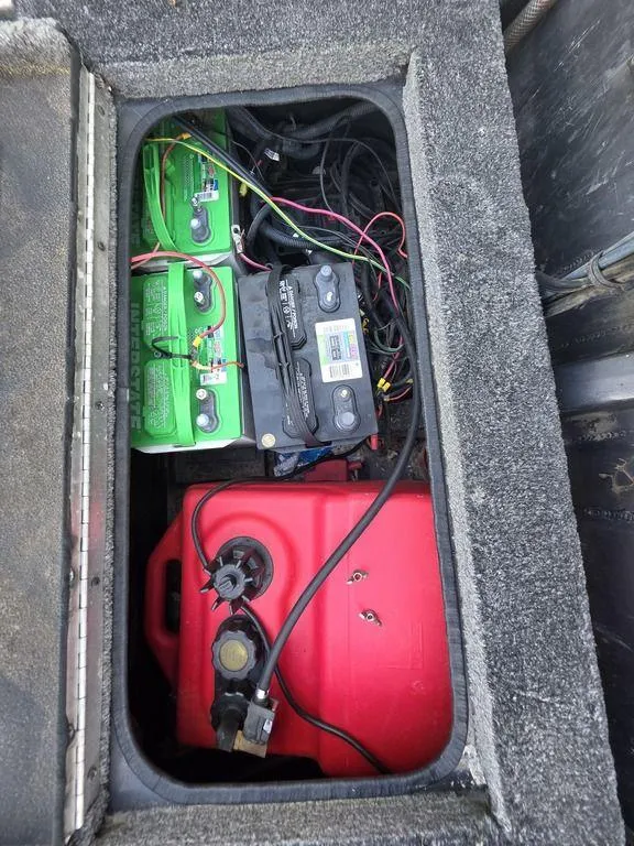 Slide: The Image of 2008 Xpress XP16PF Stick-Steer boat compartment with batteries and fuel tank. - 18