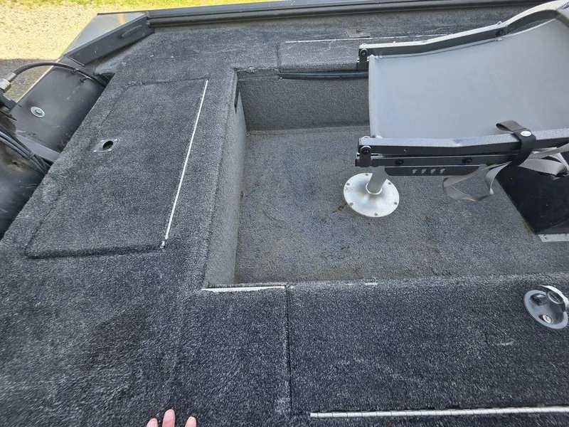Slide: The Image of 2008 Xpress XP16PF Stick-Steer boat interior with gray carpet and seating area. - 6