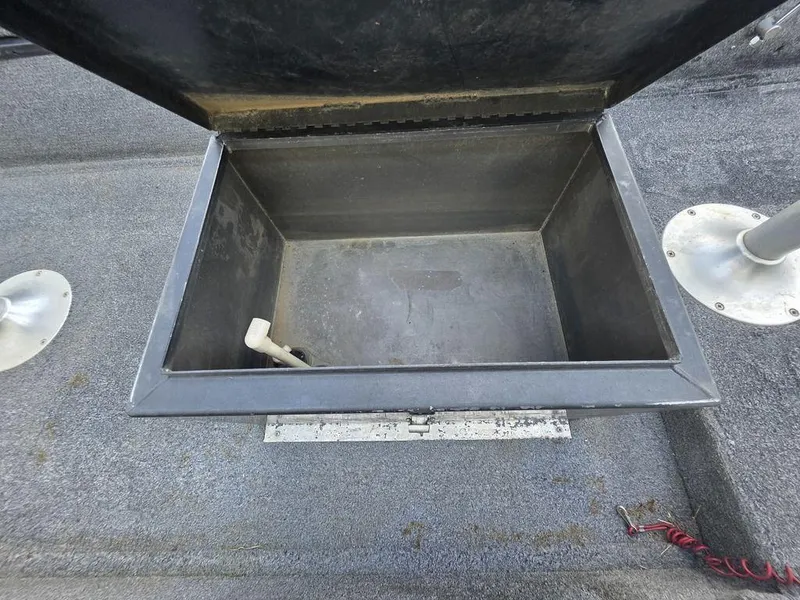 Slide: The Image of Open storage compartment on 2008 Xpress XP16PF Stick-Steer boat. - 8