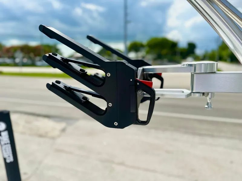 Slide: The Image of 2023 MasterCraft NXT21 wakeboard rack against a blurred outdoor background. - 12