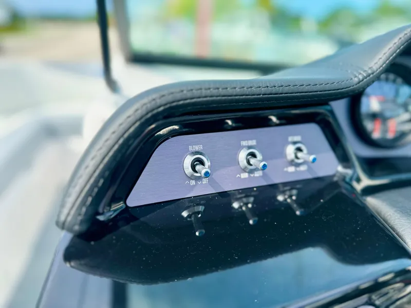 Slide: The Image of Control panel of 2023 MasterCraft NXT21 boat with toggle switches. - 18