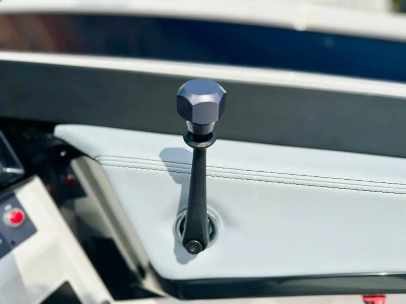 Slide: The Image of Throttle lever of 2023 MasterCraft NXT21 boat, featuring sleek design and modern controls. - 23