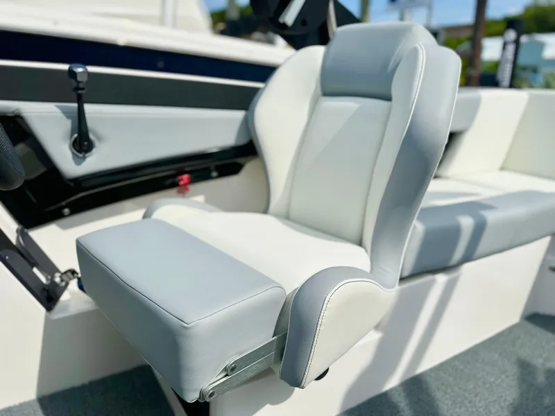 Slide: The Image of 2023 MasterCraft NXT21 boat seat, featuring sleek gray and white upholstery. - 24