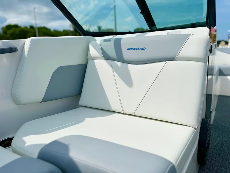 Slide: The Image of 2023 MasterCraft NXT21 boat interior with white seating and sleek design. - 31