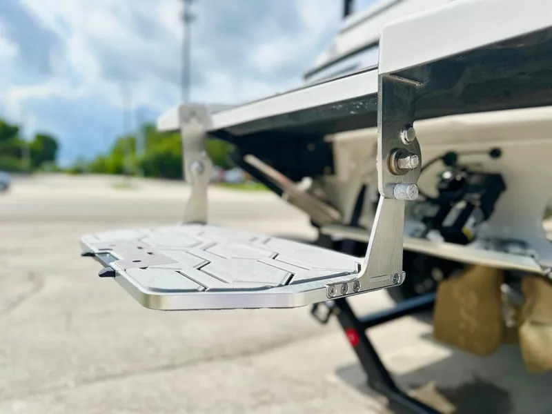 Slide: The Image of 2023 MasterCraft NXT21 swim platform detail with stainless steel brackets. - 6