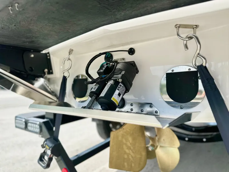 Slide: The Image of 2023 MasterCraft NXT21 boat stern with propeller and trim tab details. - 7