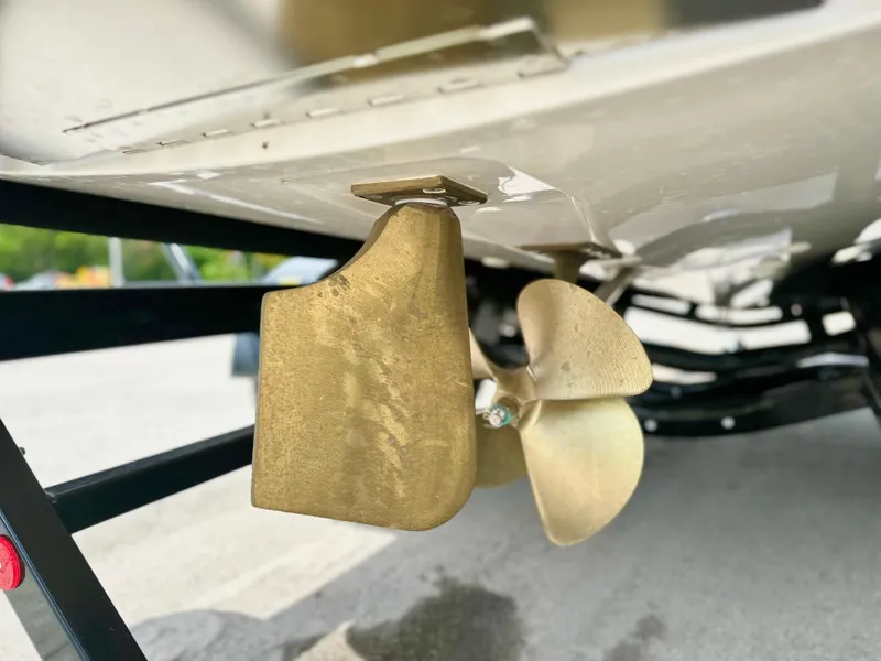 Slide: The Image of 2023 MasterCraft NXT21 boat propeller and rudder detail, showcasing sleek design and craftsmanship. - 8