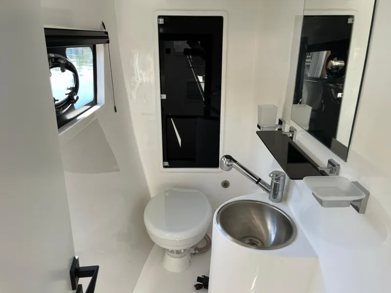 Slide: The Image of Modern bathroom in 2024 Tuna catamaran, featuring sleek fixtures and compact design. - 20