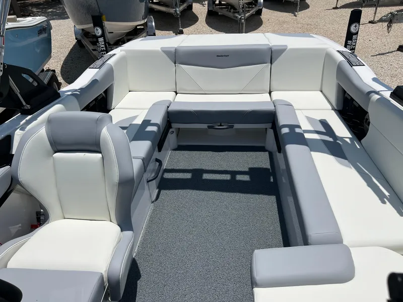 Slide: The Image of 2023 MasterCraft NXT23 boat interior with spacious seating and modern design. - 4