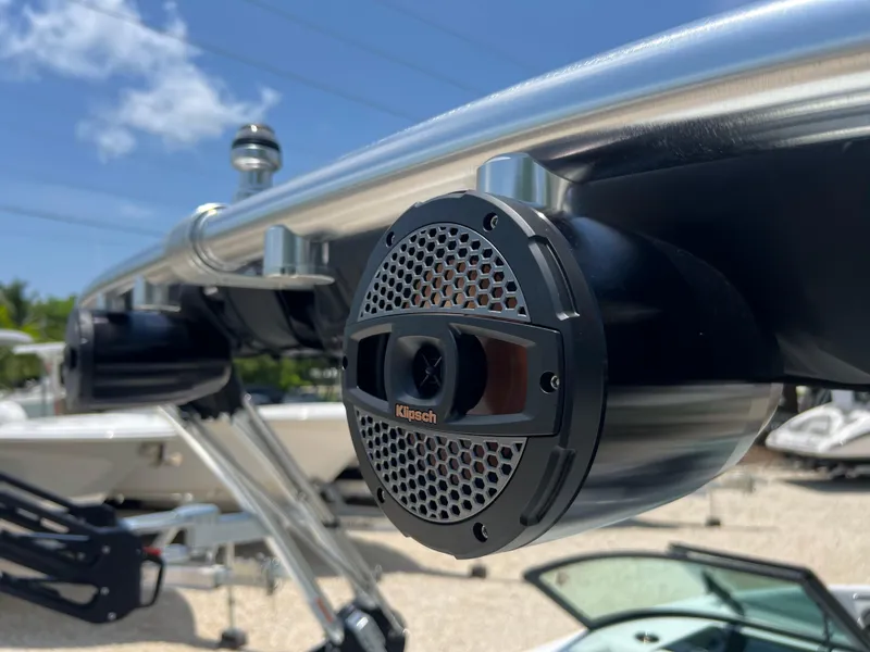 Slide: The Image of 2023 MasterCraft NXT23 boat with Klipsch speaker on stainless steel frame, sunny day. - 7