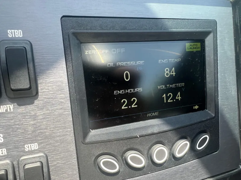 Slide: The Image of Dashboard display of a 2023 MasterCraft NXT23 showing engine metrics and controls. - 8