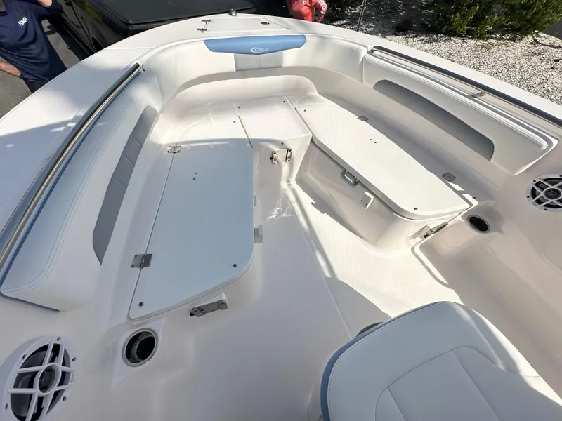 Slide: The Image of 2023 Robalo R202EX boat interior with seating and storage compartments. - 24