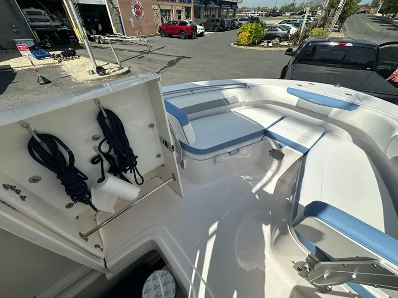 Slide: The Image of 2023 Robalo R202EX boat interior with seating and storage compartments. - 25