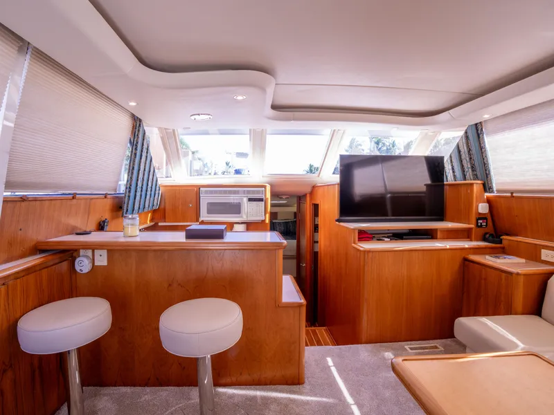 Slide: The Image of Interior of 2000 Tiara Yachts 4300 Convertible with modern furnishings and natural light. - 14