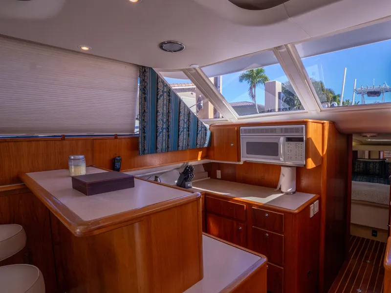 Slide: The Image of Interior of 2000 Tiara Yachts 4300 Convertible with wood cabinetry and skylights. - 17