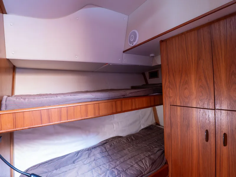 Slide: The Image of Bunk beds in 2000 Tiara Yachts 4300 Convertible cabin with wooden cabinetry. - 22