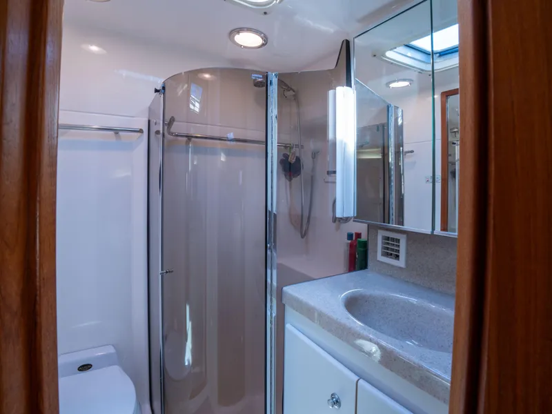 Slide: The Image of Bathroom interior of 2000 Tiara Yachts 4300 Convertible with shower and vanity. - 24