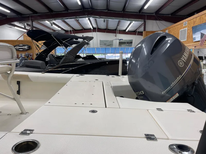 Slide: The Image of 2015 Robalo 226 Cayman boat with Yamaha engine in showroom. - 11