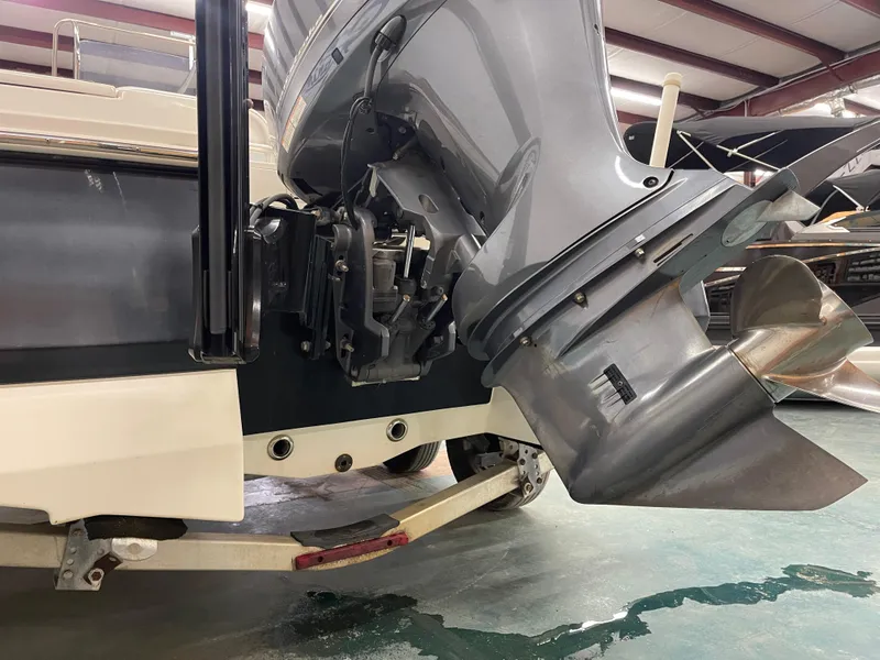 Slide: The Image of 2015 Robalo 226 Cayman boat with outboard motor in a showroom. - 9