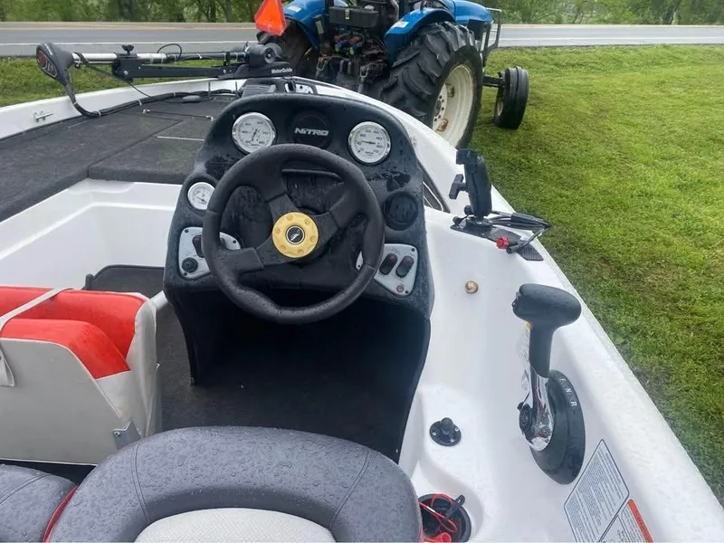 Slide: The Image of Steering console of a 2006 Nitro 750 boat, featuring gauges and controls. - 4