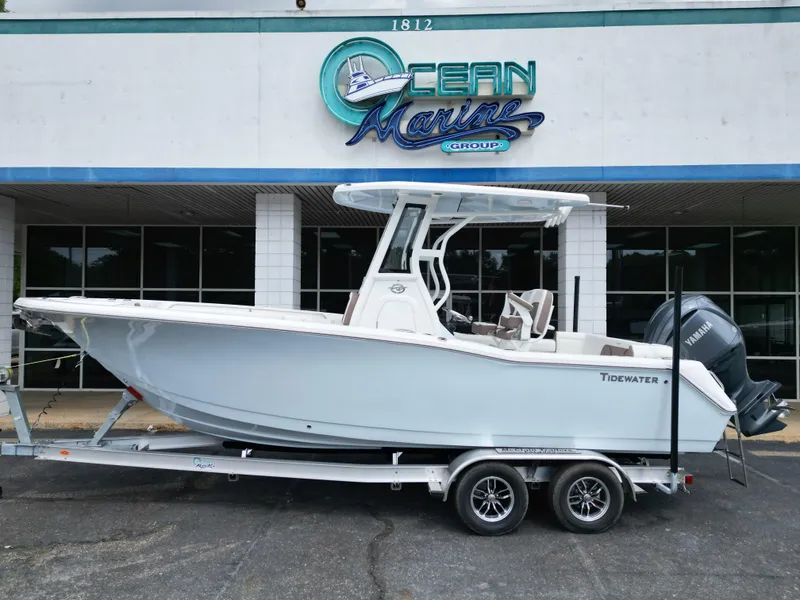 Slide: The Image of 2025 Tidewater 232LXF boat on trailer at Ocean Marine Group dealership. - 1