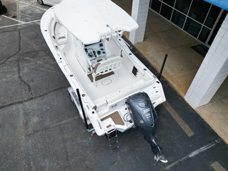 Slide: The Image of 2025 Tidewater 232LXF boat with Yamaha 300 V6 engine, parked on a trailer. - 14