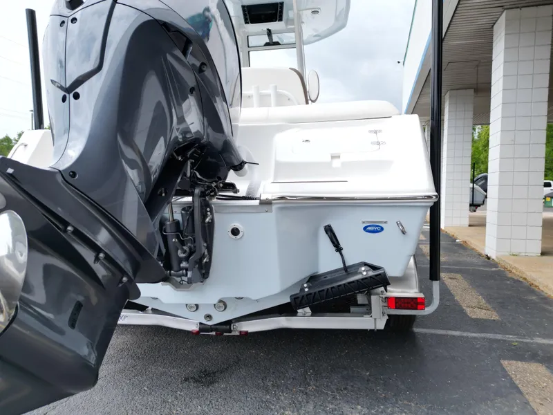 Slide: The Image of 2025 Tidewater 232LXF boat with powerful outboard motor, parked on a trailer. - 16