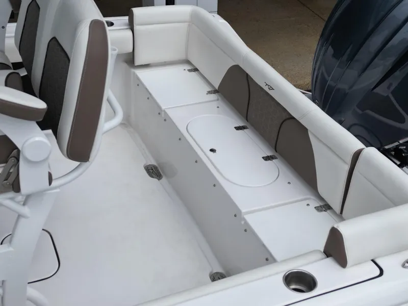 Slide: The Image of 2025 Tidewater 232LXF boat interior with cushioned seating and storage compartments. - 20