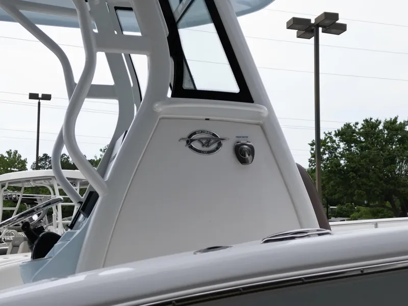 Slide: The Image of 2025 Tidewater 232LXF boat console with logo and fresh water control. - 23