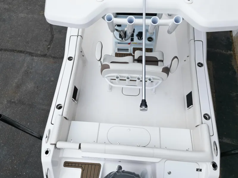 Slide: The Image of 2025 Tidewater 232LXF boat interior, featuring seating and rod holders, viewed from above. - 24