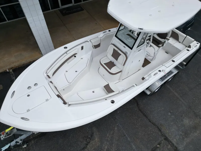 Slide: The Image of 2025 Tidewater 232LXF boat, aerial view, showcasing spacious deck and seating arrangement. - 3
