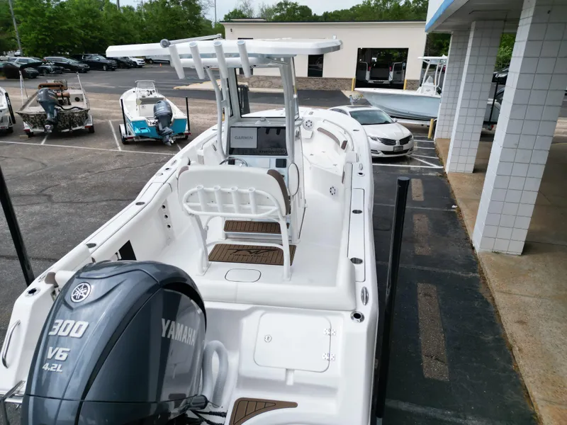 Slide: The Image of 2025 Tidewater 232LXF boat with Yamaha 300 V6 engine in a dealership lot. - 6