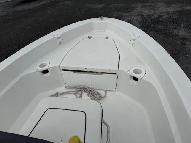 Slide: The Image of 2020 Wellcraft 162 Fisherman boat interior with storage compartment and cup holders. - 10