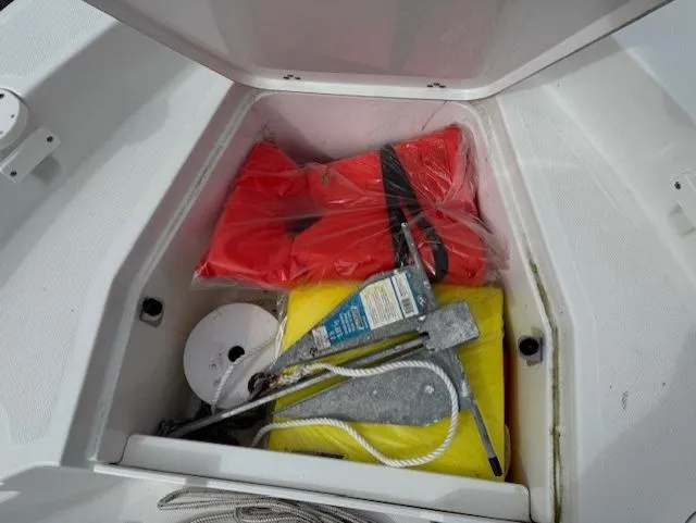 Slide: The Image of Storage compartment of 2020 Wellcraft 162 Fisherman with life jackets and boating gear. - 12