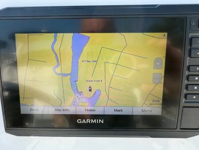 Slide: The Image of Garmin navigation system on 2020 Wellcraft 162 Fisherman displaying a detailed waterway map. - 14