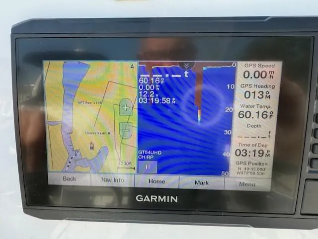 Slide: The Image of Garmin GPS display on 2020 Wellcraft 162 Fisherman, showing navigation and sonar data. - 15