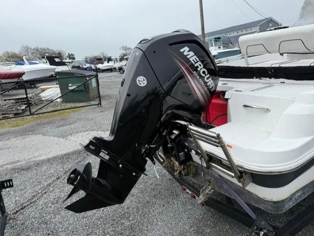 Slide: The Image of 2020 Wellcraft 162 Fisherman with Mercury outboard motor in a marina setting. - 3