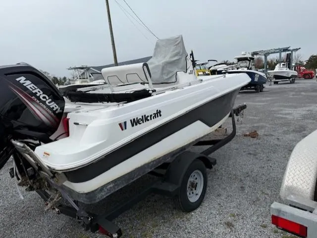 Slide: The Image of 2020 Wellcraft 162 Fisherman boat on trailer, featuring a Mercury outboard motor. - 4
