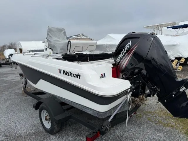 Slide: The Image of 2020 Wellcraft 162 Fisherman boat with Mercury engine on trailer, parked outdoors. - 5