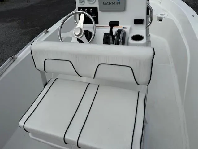 Slide: The Image of 2020 Wellcraft 162 Fisherman boat interior with white seating and Garmin navigation system. - 8